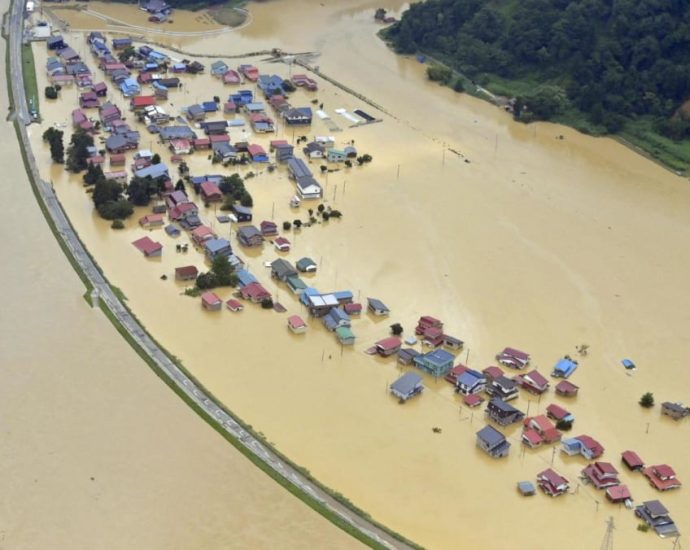 Thousands evacuated as record rains pound northern Japan