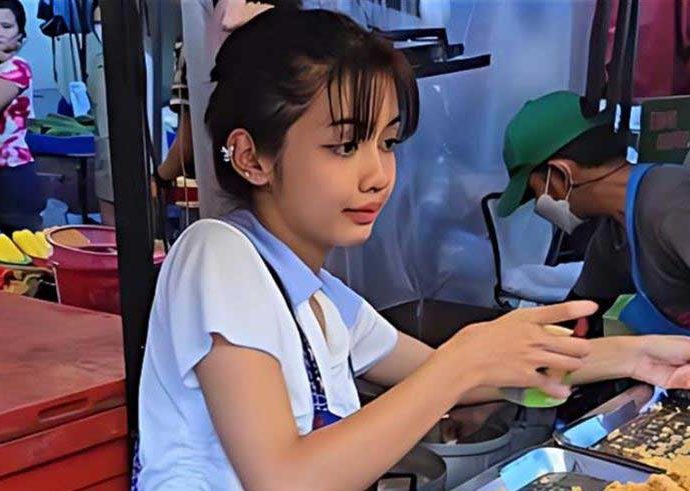 Young fried chicken seller said to resemble Lisa
