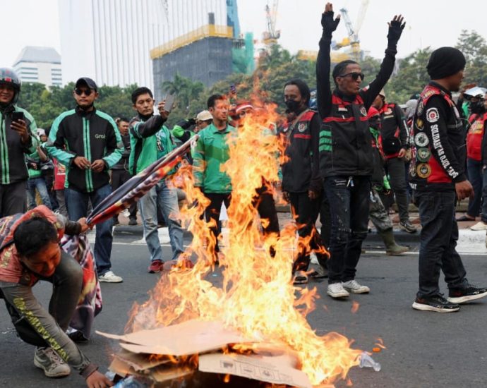 Indonesian app-based motorcycle taxi drivers strike in protest over low pay