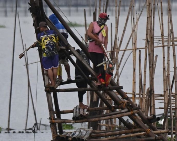 Philippines fishermen worry solar farm on lake will hurt incomes