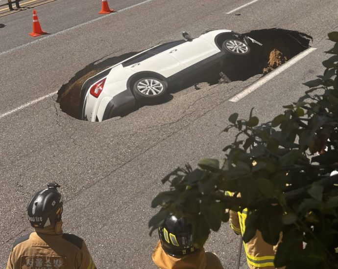 Two injured after sinkhole swallows car in Seoul: Reports