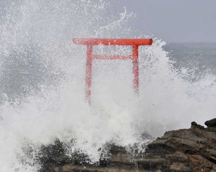 Typhoon Ampil veers away from Japan, allowing trains, some flights to resume