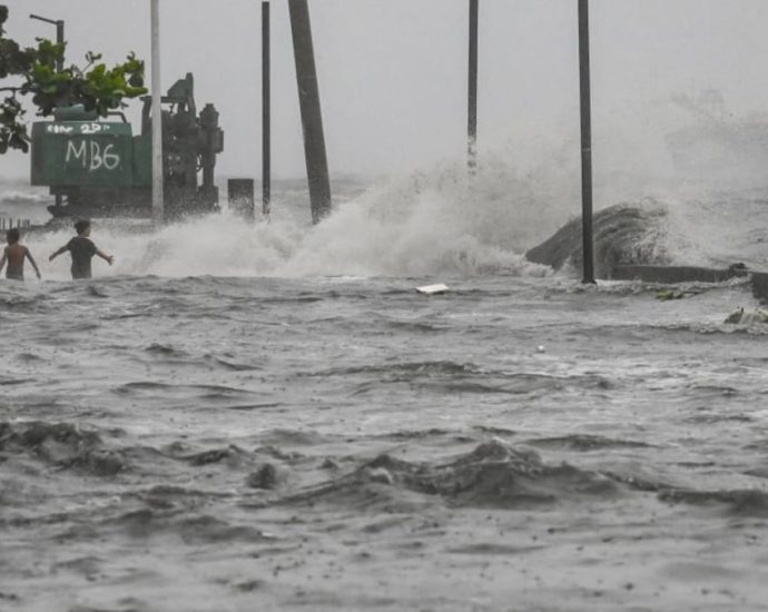 Four dead as tropical storm floods Philippines, disrupting schools and flights