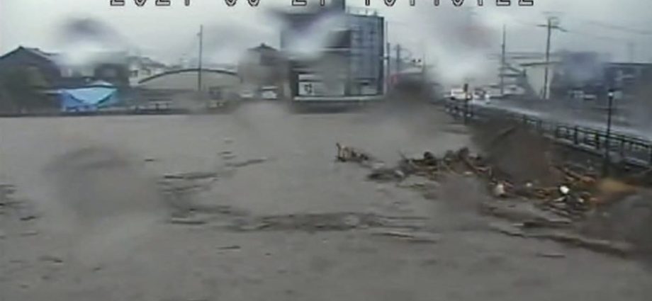 Japan orders evacuations as heavy rains trigger floods in quake-hit region