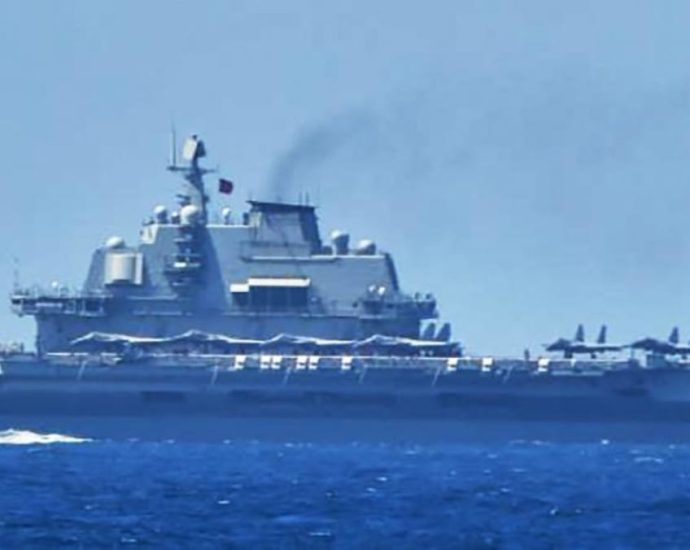 Japan says Chinese carrier entered its contiguous waters for first time