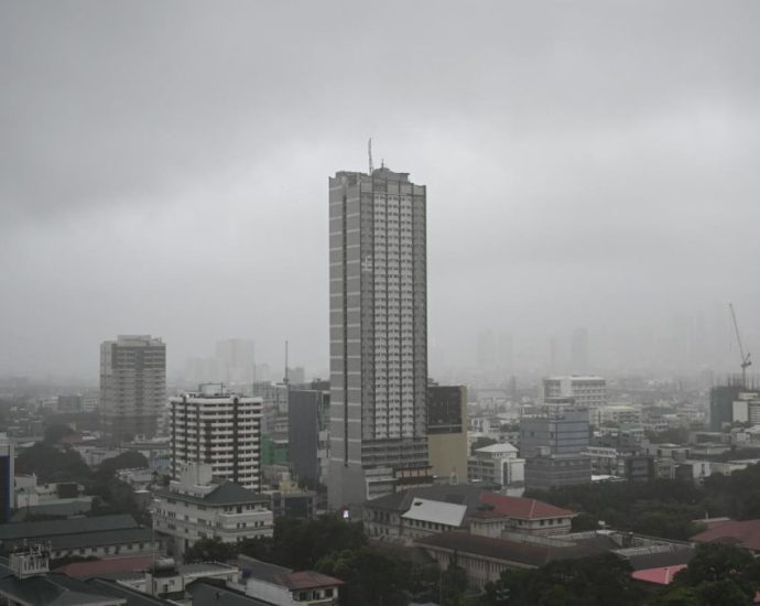 Storm floods northern Philippine regions, including capital, disrupting schools, work and travel