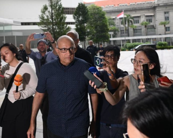 Former transport minister S Iswaran arrives at the State Courts to surrender and begin jail term