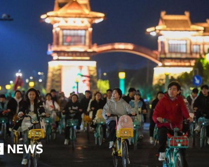 China roads blocked by thousands of cyclists in night quest for dumplings