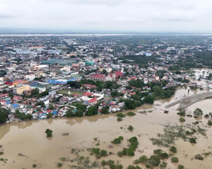 Floods hit northern Philippines after typhoon forces dam release