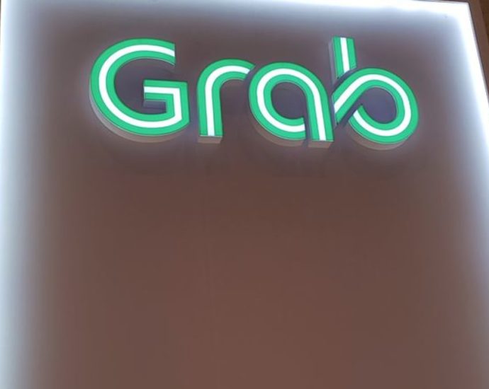 Grab raises annual revenue forecast, shares jump