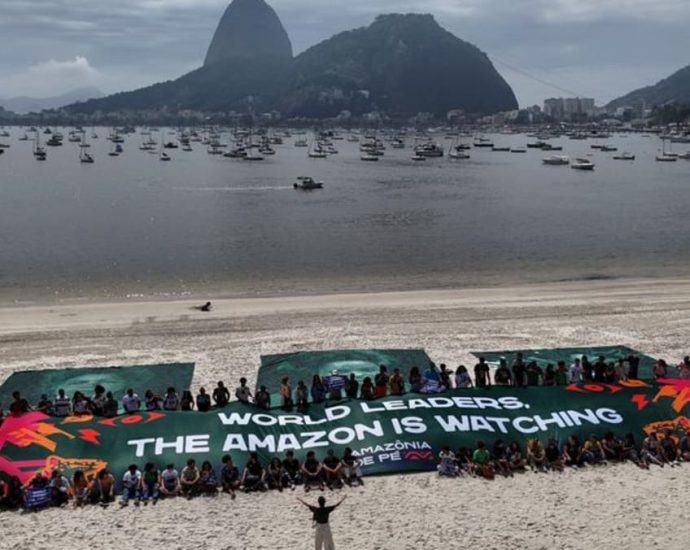 Troops, armoured cars protect G20 summit, as favelas champion solar