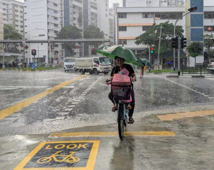 What is Singapore doing to protect people from floods?