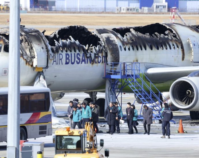 Investigators cautious of jet fuel still aboard wrecked South Korean plane