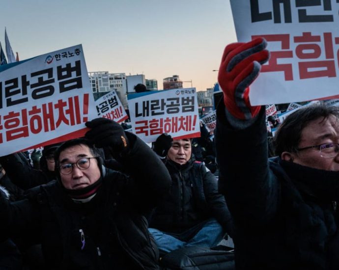 Thousands of South Koreans protest as president digs heels in