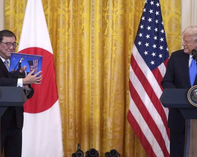 Trump says US and Japan will work to cut trade deficit as he greets Ishiba