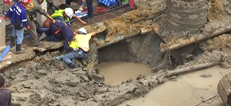 Frantic rescue: Worker plummets into deep excavation  hole