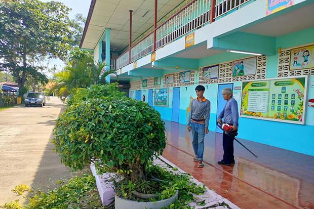 Students forced to raise flag outside during storm