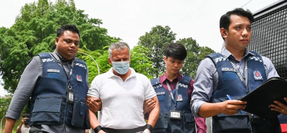 Two men accused of breaking into Bukit Timah home taken back to crime scene